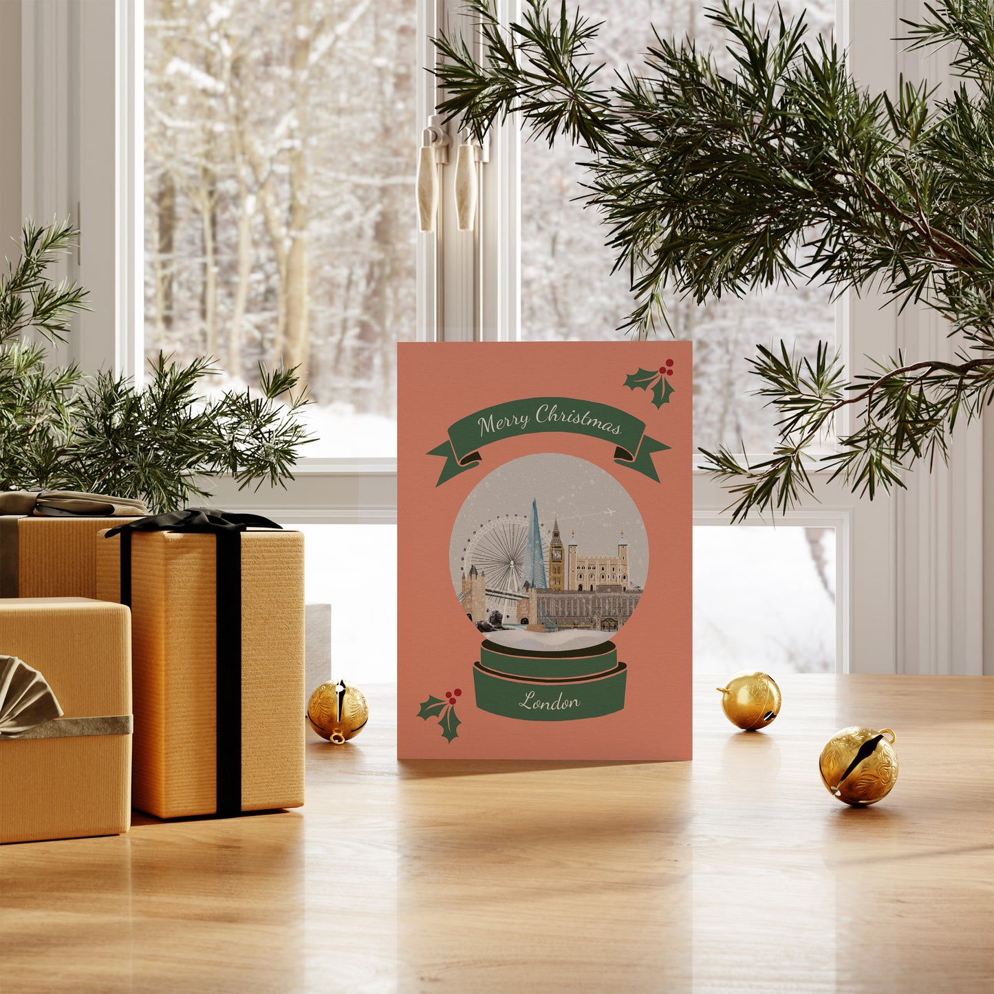 London Christmas card with illustrations of London landmarks. Pictured on table with snowy scenery