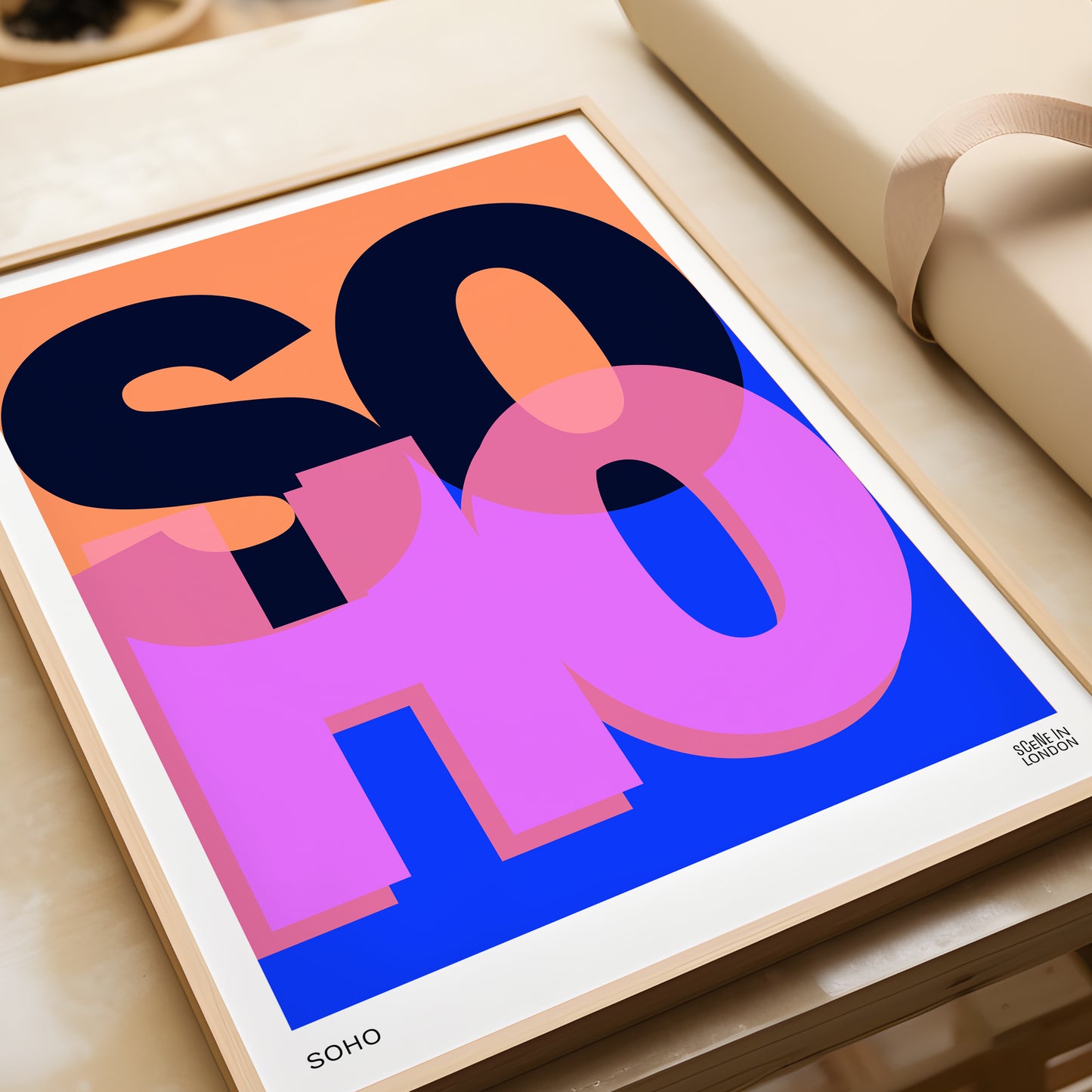 Framed artwork poster with colourful 'SOHO' typography